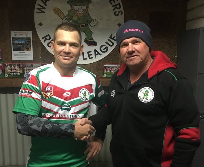 NEW JOB: Peter Little is congratulated by Brothers president Craig Stewart after signing on as coach for 2019.