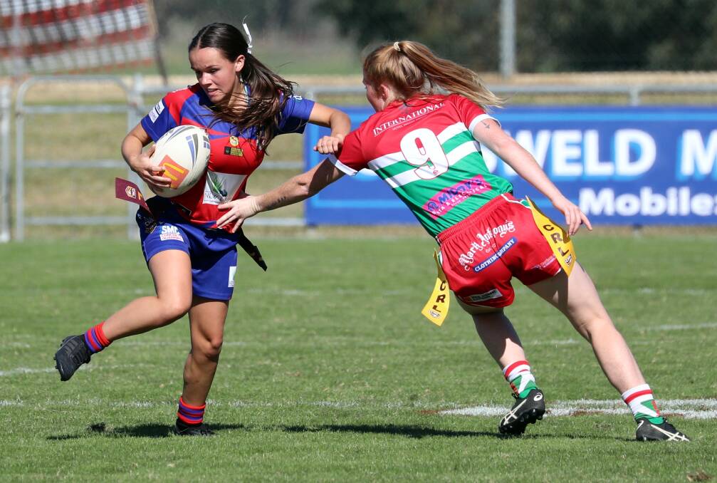 ON THE STRETCH: Bridget Horsley tries to tag Shanae Pope in Brothers win over Kangaroos at Equex Centre on Sunday. The 16-4 win sees the premiers remain undefeated to start the season. Picture: Les Smith