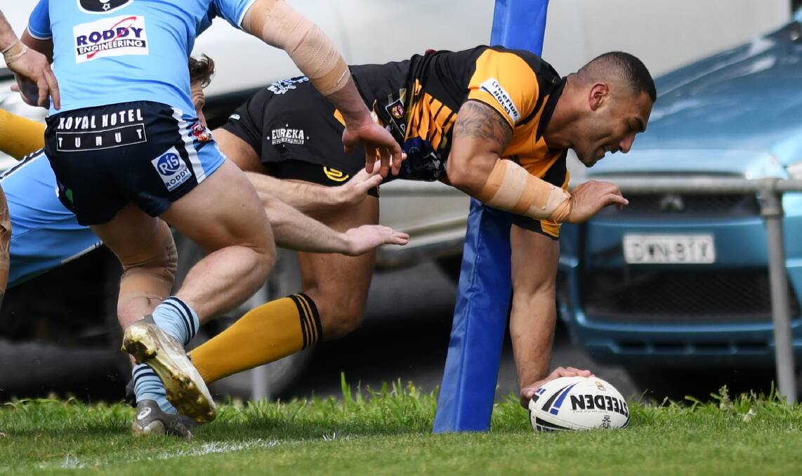 TRY TIME: Noa Fotu stretches out to open the scoring in Gundagai's big win over Tumut to take the minor premiership at Anzac Park on Sunday.