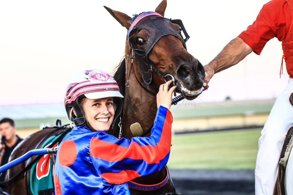 HOT SREAK: Isobel Ross had plenty of reason to be happy after another strong win with Gotta Party Doll in the Temora Pacers Cup on Saturday. Picture: Coffee Photography