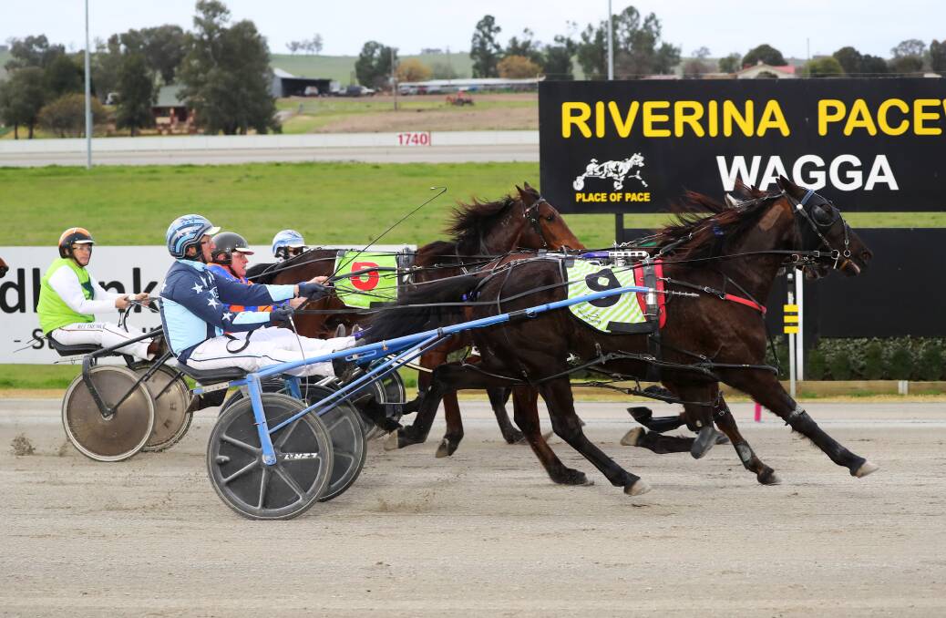 TIGHT GO: Jackson Painting times his arrival to perfection to take out the Riverina Locals Pace Final (2270m) with Flaneur at Riverina Paceway on Friday. Picture: Emma Hillier