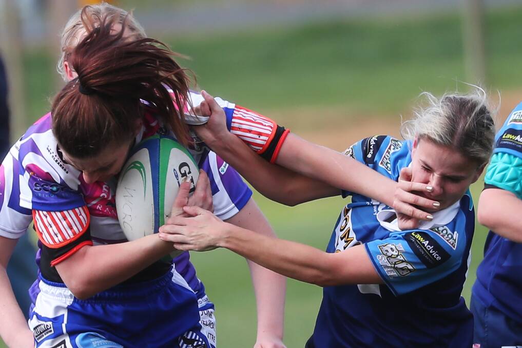 STRONG ARM: Jess Burgess tries to fend off and Amy Fowler during Wagga City's loss to Waratahs at Conolly Rugby Complex on Saturday. Picture: Emma Hillier
