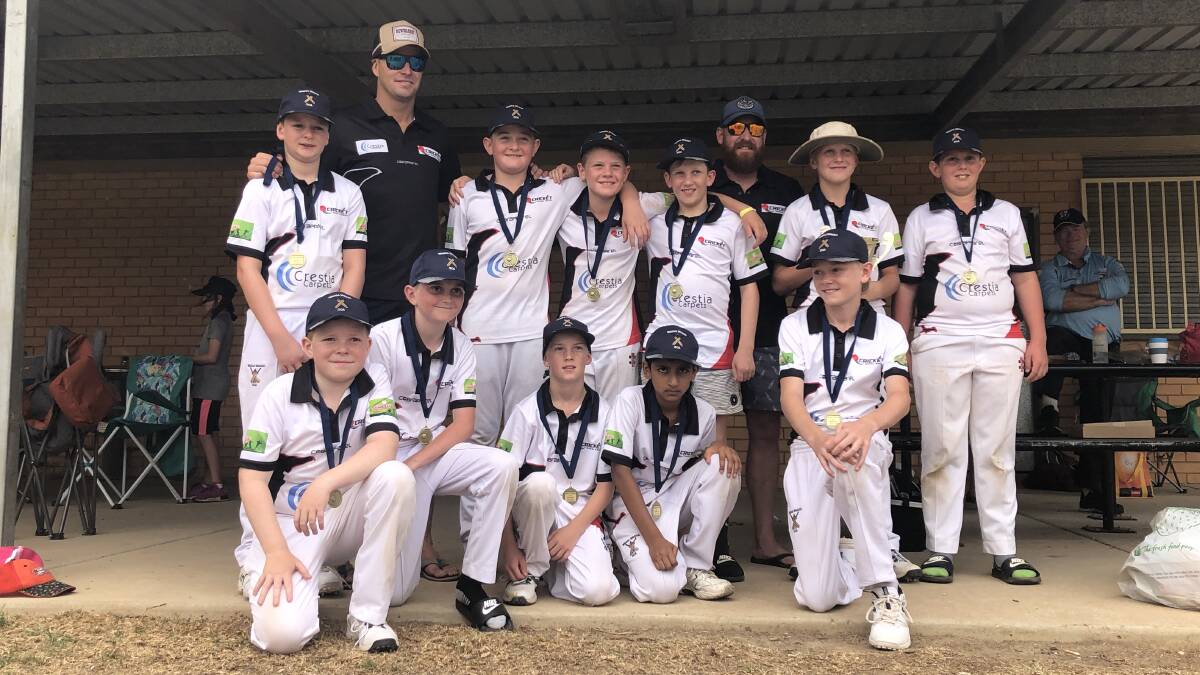 SWEET SUCCESS: Wagga's under 12 side celebrate after going through the season undefeated after winning the Derek Rogers Cup and Stacey Shield.