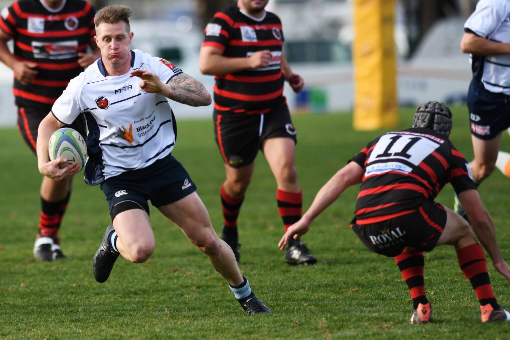SPEED TO BURN: Blake Hart wrong foots Will McLennan-Dye in Waratahs' win over Tumut at Conolly Rugby Complex on Saturday.