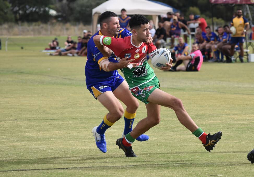 GOOD START: Latrell Goolagong tries to break out of the Coogee defence as Brothers retained the Dave Mavroudis Shield on Saturday. Picture: Courtney Rees.