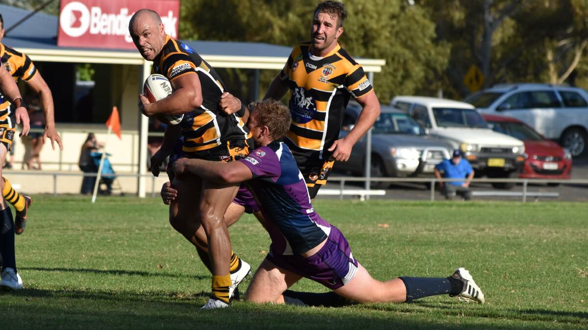 LOSING START: Luke Berkrey, pictured being tackle by Tim Hurst on Sunday, has moved to five-eighth this season for Gundagai. They are looking to stop their worst start to the season since 2008 against Young. Picture: Courtney Rees