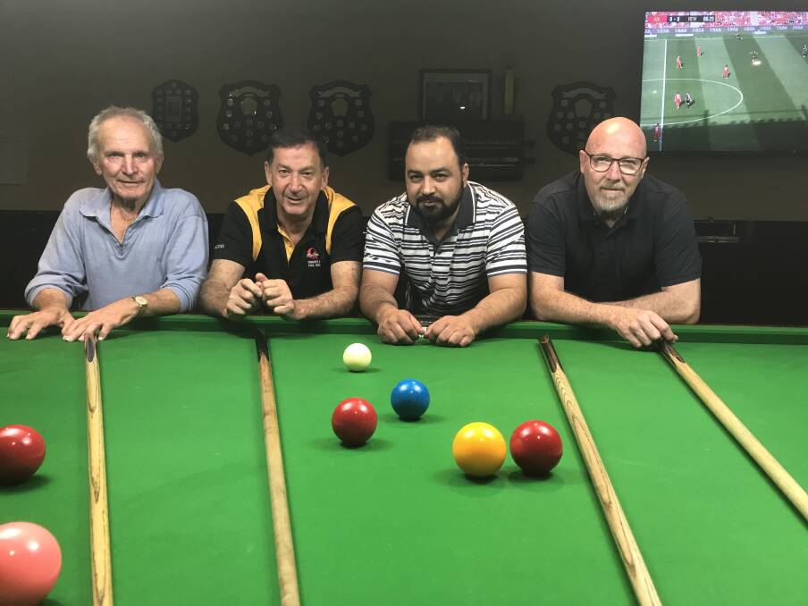 TOUGH BATTLE: Terry Storch and John Wells went down to Hamid Khan and Peter Corcoran in the summer pennants finals at Wagga RSL Club.