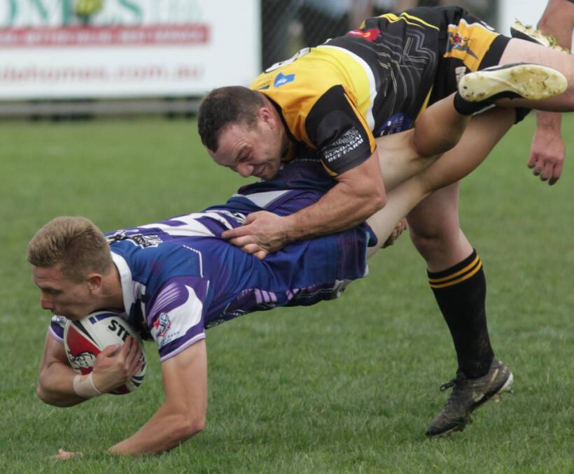 Cody Hodge being tackled by Blake Dunn in Southcity's 2016 grand final victory.