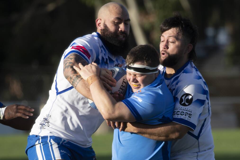 WRAPPED UP: Harry Middlebrook is tackled by Monson Tuvale and Mikaera Smylie in Wagga City's big win over Waratahs. Picture: Madeline Begley