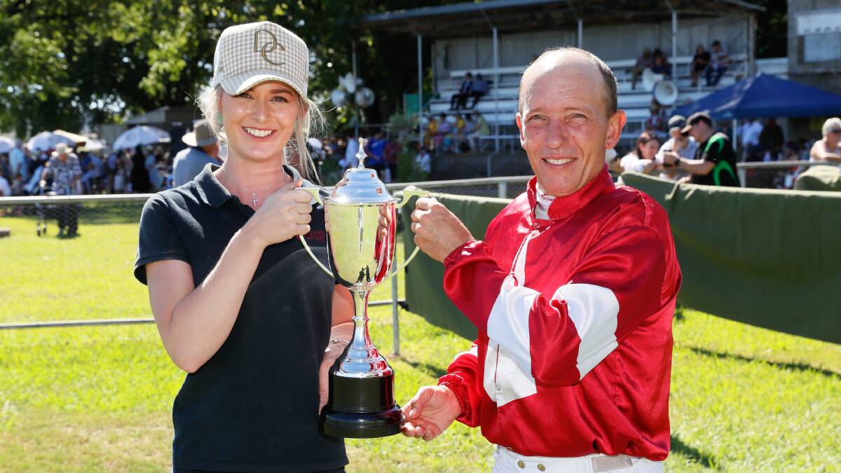 Strapper Laura O'Connor and Brad Vale celebrate Eamonn's Memory's win in the Tumbarumba Cup on Saturday. Picture by Courtney Rees