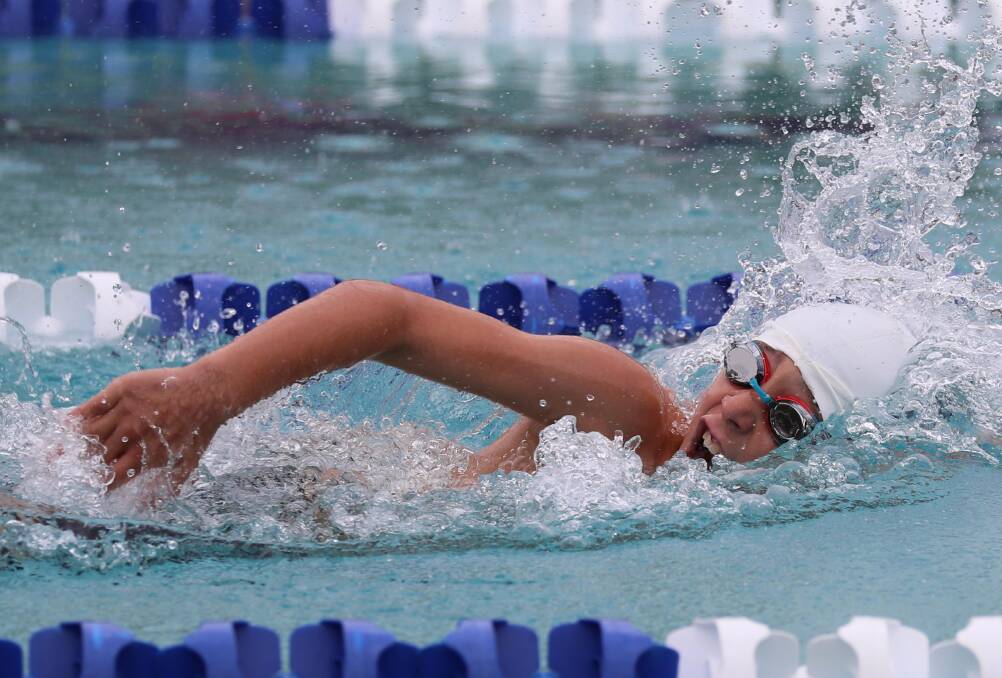 POWERING AWAY: Tom Swann, 9, of Mater Dei Catholic College swims the final leg to win a 4x50m relay at the combined Wagga Diocesan - Riverina Associated Schools carnival on Wednesday. Picture: Les Smith
