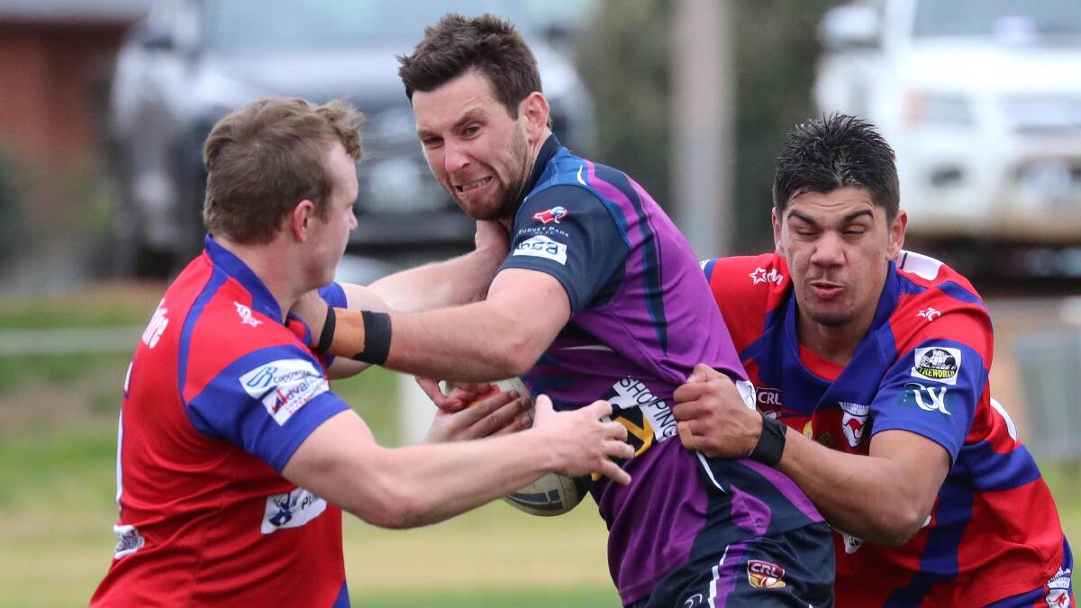 Jake Dooley, looking to break out of a tackle against Kangaroos last season, won't be back for a fourth year with Southcity.