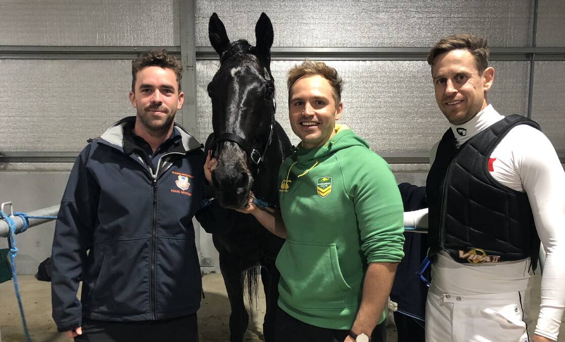 PURPLE PATCH: Co-owners Ryan Robertson, Luke Kelly and Jared Kahlefeldt, are hoping for more success with Twentyeightblack at Riverina Paceway on Friday.