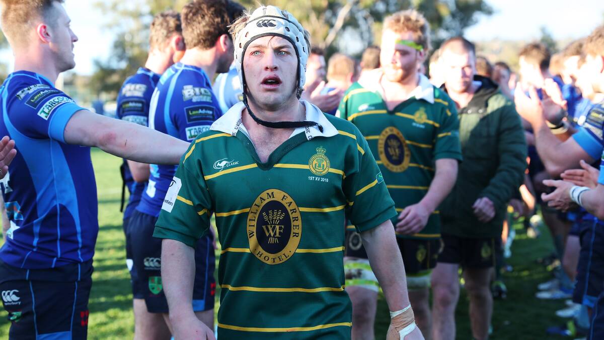 FALLING SHORT: Ag College captain Cameron Duffy cuts a devastated figure as he leads his side through the tunnel following their loss to Waratahs in the Southern Inland grand final on Saturday. Picture: Emma Hillier