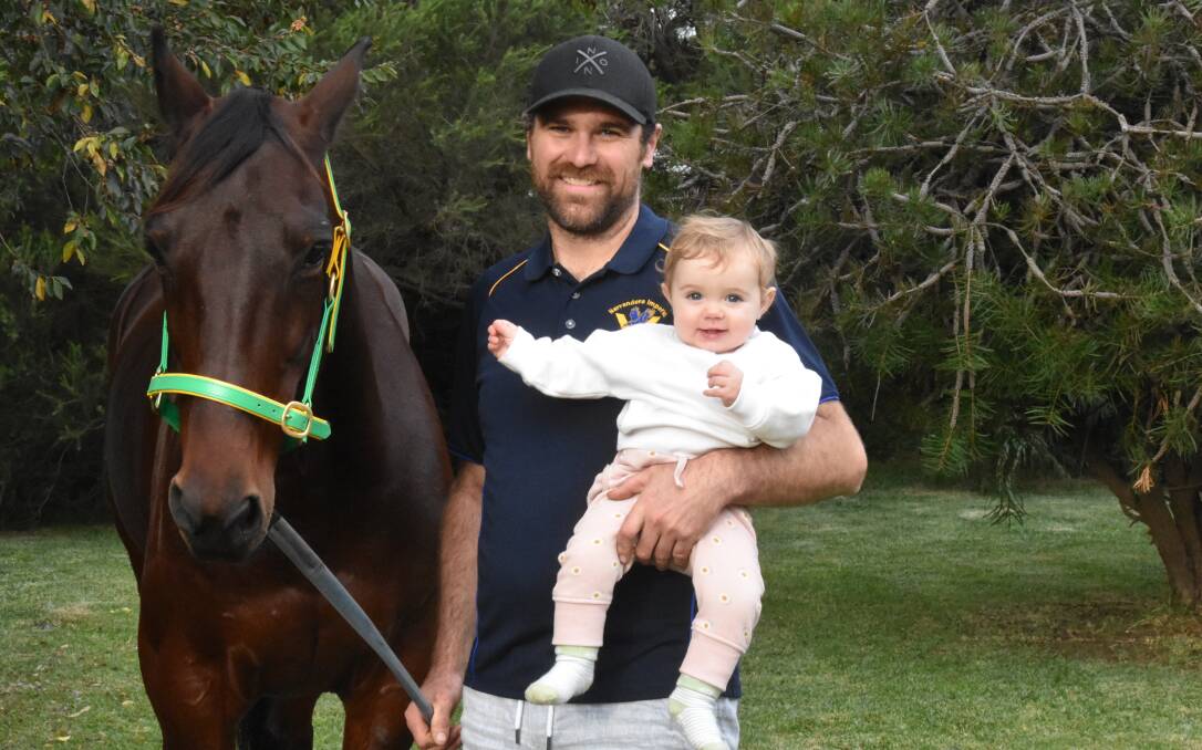 GROUP ONE SHOT: Drew Kenna with 10-month-old daughter Camilla and Barrett
ahead of their tilt at the Regional Championships State Final
at Menangle on Saturday night. Picture: Courtney Rees