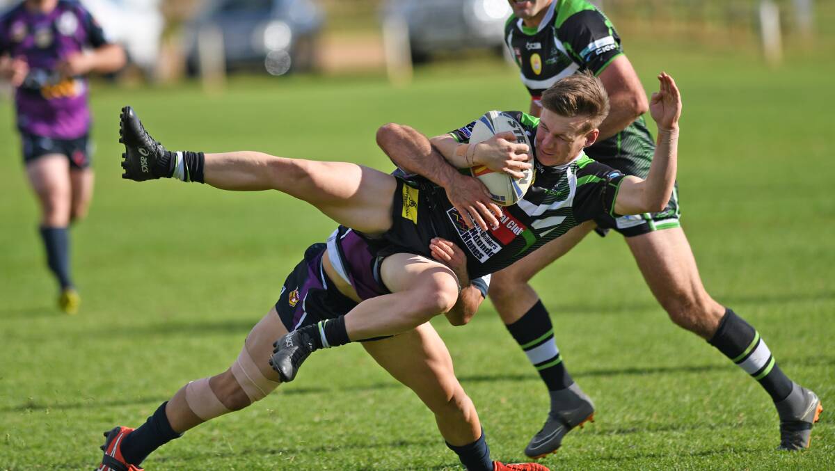 COP THAT: Nathan Rose sends James Girdler flying in Southcity's big win over Albury at Harris Park on Sunday.