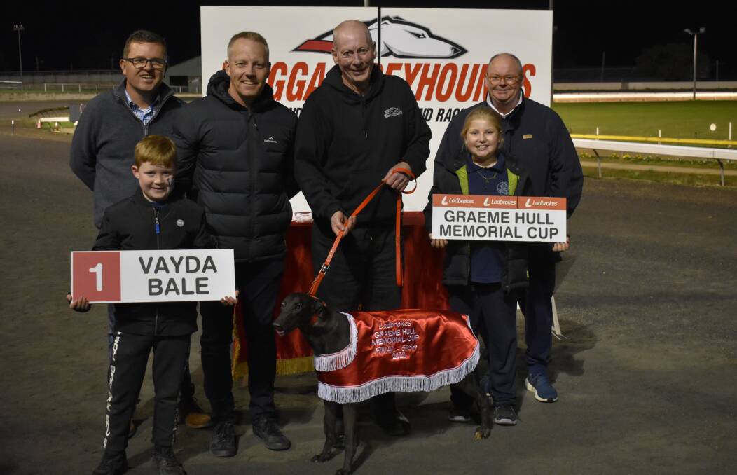 SWEET SUCCESS: Handler Neil Jones with Vayda Bale at the presentation of the Graeme Hull Memorial Cup on Friday night. Picture: Courtney Rees