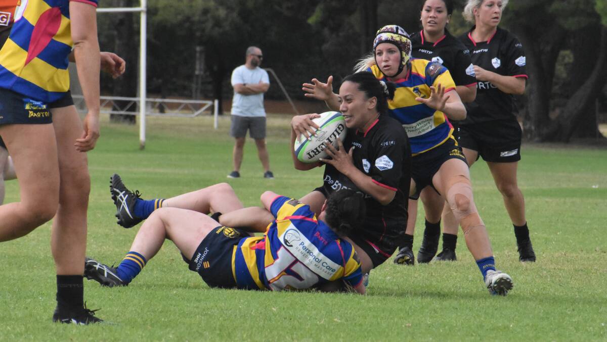 FAST START: Amelia Lolotonga is brought down by the Albury defence as the Blacks got their season off to a strong start on Saturday. Picture: Liam Warren