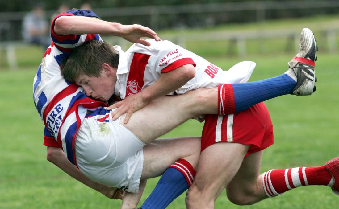FLASHBACK: Josh McCrone making a tackle on Michael Dawe in the 2005 Weissel Cup grand final. It is the last game he's played in the region.