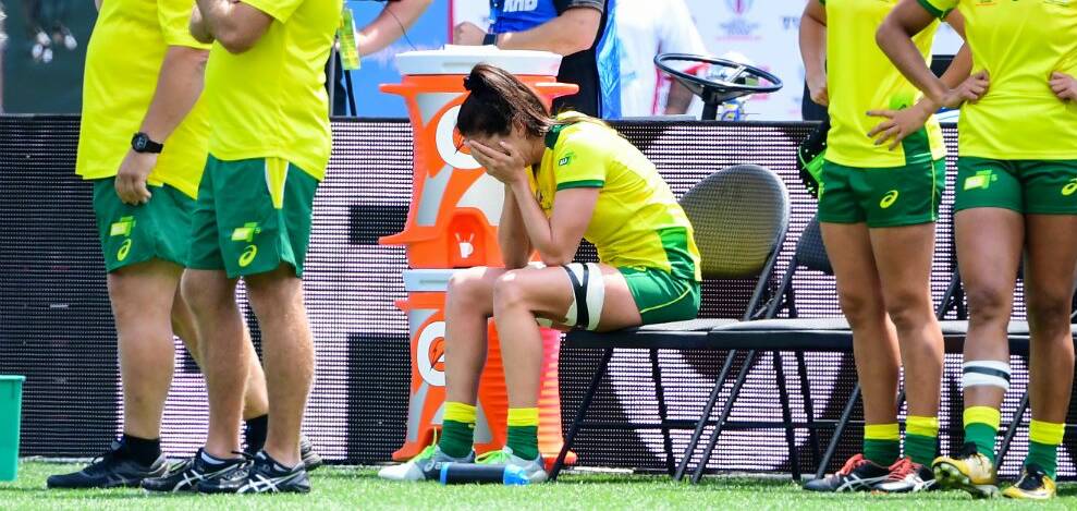 DOWN AND OUT: Alicia Quirk with her head in her hands after being injured in Australia's World Cup semi-final loss to France on Sunday. Picture: rugby.com.au/Stuart Walmsley