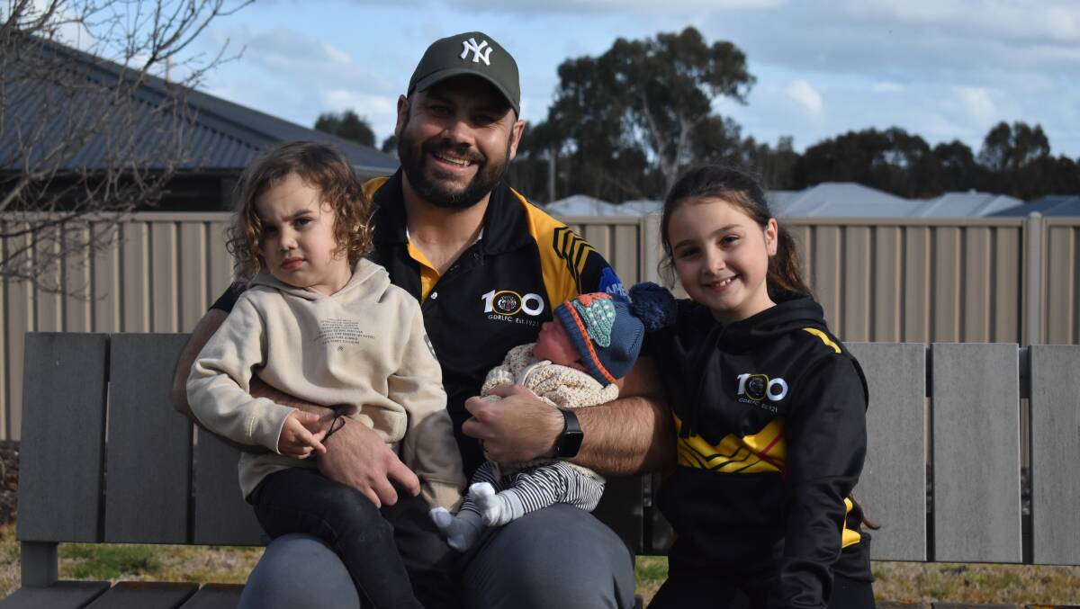 BACK IN THE GAME: Gundagai forward Blake Dunn, with his children Artie, 3, newborn Bowie, and Maya 8, has returned to the Tigers starting side after thyroid cancer treatment. Picture: Courtney Rees