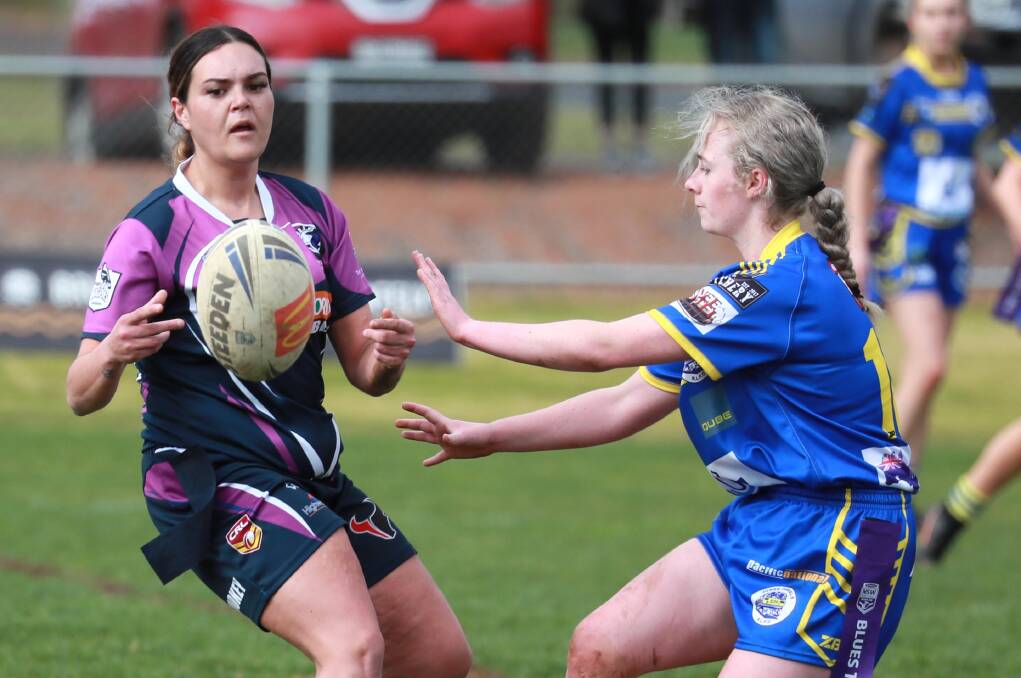IN CONTROL: Montana Kearnes fires out a pass under pressure from Kate Bradley in Southcity's win over Junee at Harris Park on Sunday. Picture: Les Smith