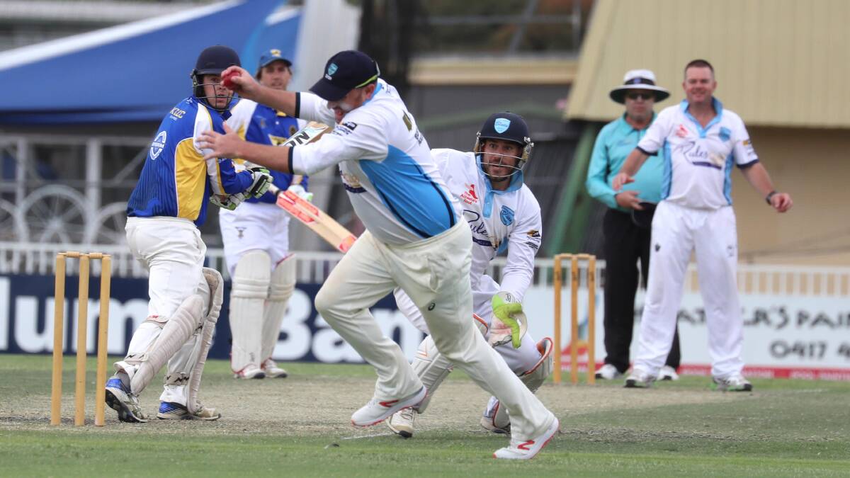 FAST HANDS: South Wagga's Warren Clunes clings on to a catch in the slips to remove Andrew Dutton before claiming six wickets of his own on Saturday. Picture: Les Smith