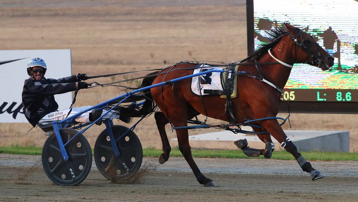 HOLDING ON: Blake Jones just gets Glamors Symbol home for trainer Paul Kahlefeldt in the Happy Retirement Allan Hill Pace at Riverina Paceway on Tuesday. Picture: Emma Hillier