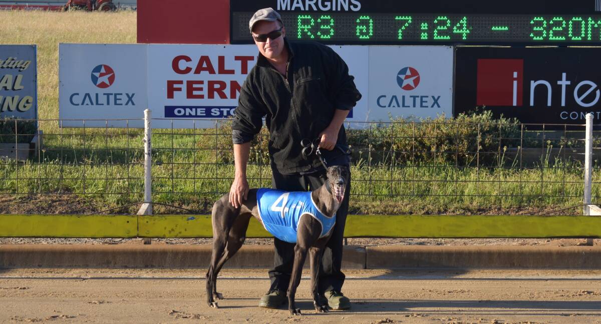 WINNERS ARE GRINNERS: Handler Tim McCaffery with Secret Snaps after she broke through for her first win at start eight at Wagga on Friday. Picture: Courtney Rees
