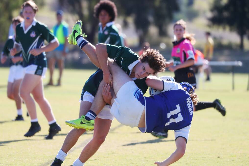 DUMPING: Jack Lloyd sends Tyler Edwards to the ground in one of a number of big defensive plays for the TRAC second rower in Monday's Hardy Shield win. Picture: Emma Hillier