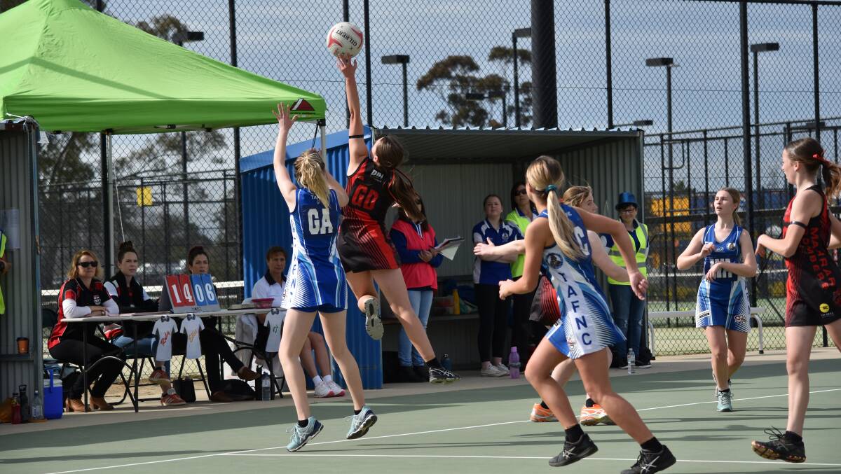 Action and celebration from the courts and football field on the Farrer League's big day. 
Pictures: Les Smith (football) and Jacob Manley (netball)