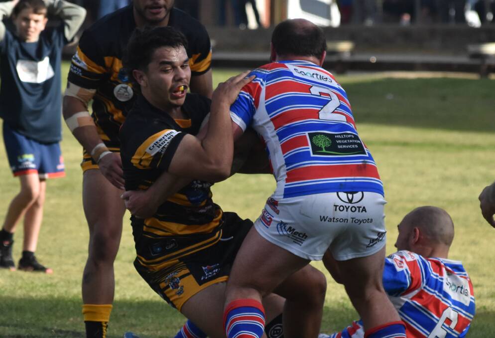 BIG IMPACT: Latrell Siegwalt is stopped by Jake Veney during Gundagai's 34-16 win over Young at Alfred Oval on Sunday. Picture: Courtney Rees