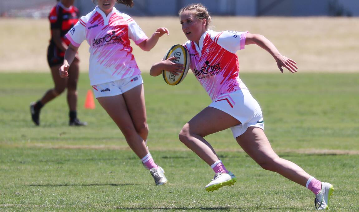 ON THE BURST: Charlotte Horan with the ball for Tuggeranong Vikings in their clash against Bateman's Bay in the Super Sevens Series at Parramore Park on Saturday. Picture: Emma Hillier