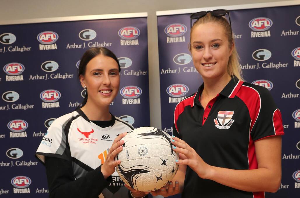 READY FOR BATTLE: The Rock-Yerong Creek's Emily O'Leary and North Wagga's Kaitlin Staines shape up ahead of the A grade netball grand final on Saturday. Picture: Les Smith