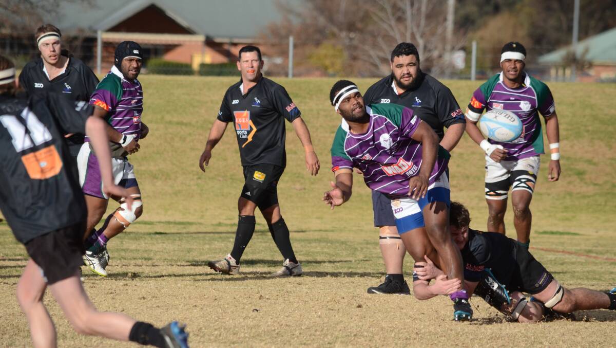 ONSLAUGHT: Andrew Madden can't stop Sai Ratugradra from popping a ball up for his Leeton teammate during Phantoms' 144-8 win over Griffith at Leeton No.1 Oval on Saturday. Picture: Liam Warren