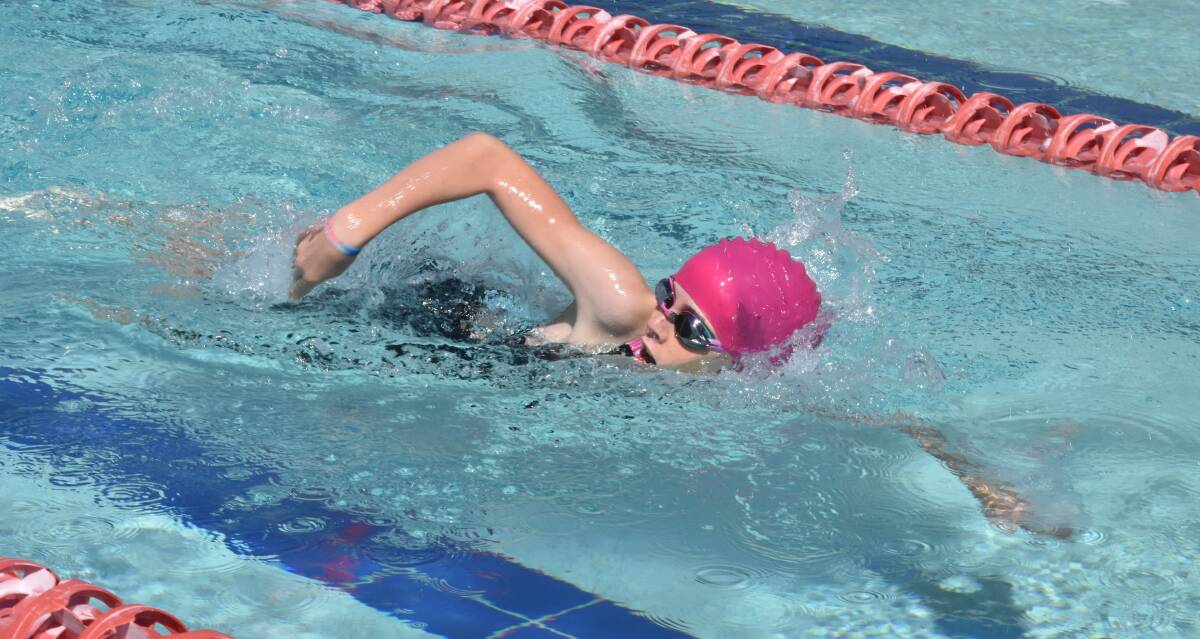 VICTORY LAP: Olivia Junck, 12, goes on to win her 50 metres freestyle race at The Riverina Anglican College's competitive swimming carnival at Oasis on Monday. Picture: Courtney Rees