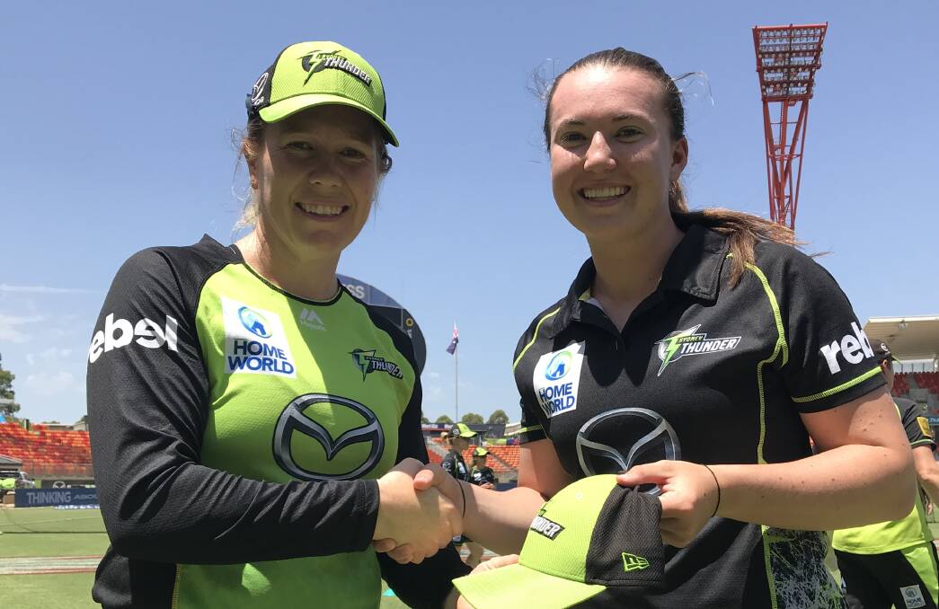 Alex Blackwell presents Rachel Trenaman with her Sydney Thunder cap last week. Both played a role in the team's win over Melbourne Renegades on Tuesday.