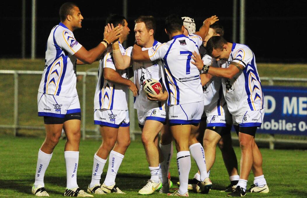 Group Nine celebrates a try against Group 20 in the Kelly Cup clash at Equex Centre in 2015.
