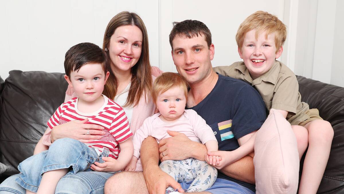 FAMILY TIME: Rob Nicoll with wife Eloise and children Oliver, 4, Willow, nine months and Joshua, 9, relax at home following his Multiple Sclerosis diagnosis. Picture: Kieren L Tilly
