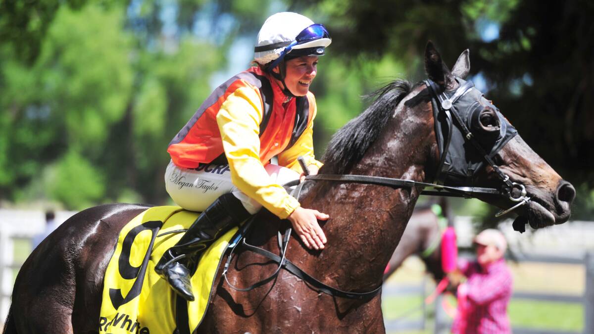 JOB WELL DONE: Megan Taylor gives Glycerine Queen a pat after her first win at Tumut on Saturday. Picture: Chelsea Sutton