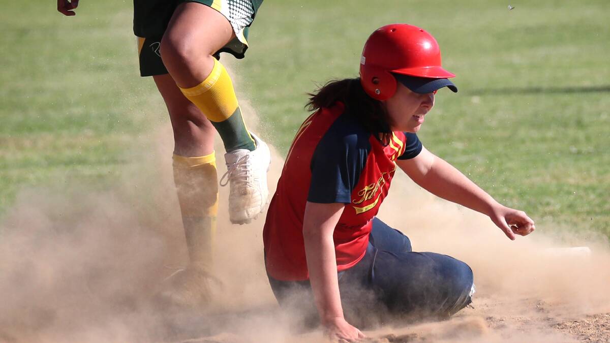 COMING HOME: Sarah Carter slides safely to second base during Turvey Park's massive loss to South Wagga Warriors on Saturday. Picture: Les Smith