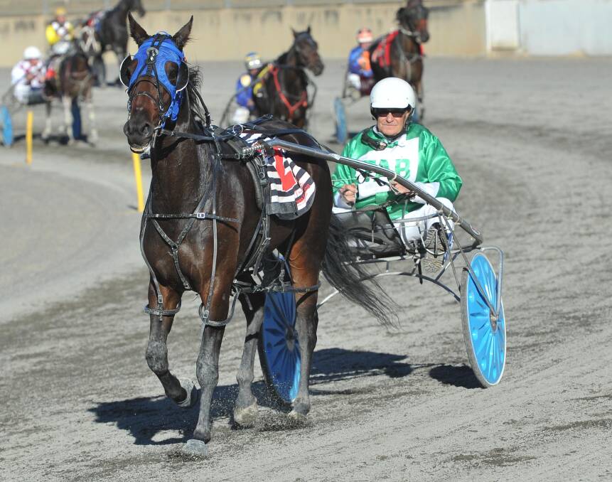 STILL GOT IT: Veteran Coolamon trainer-driver John Hanrahan with Home By Dark after the pair won at Wagga in 2015.