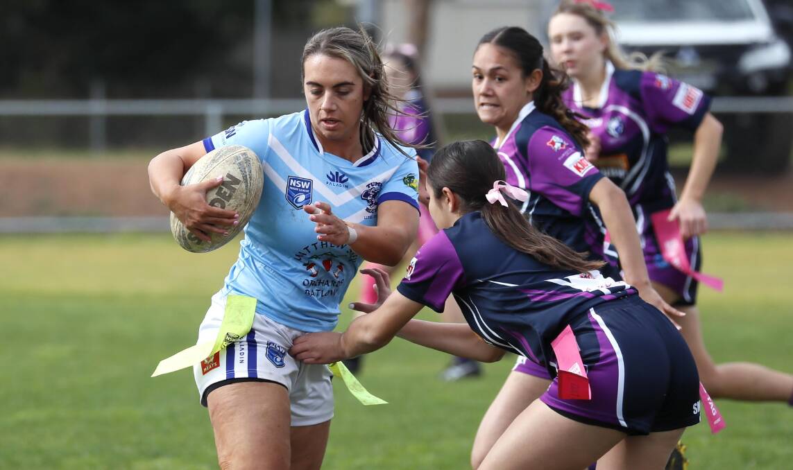 SURROUNDED: Tumut's Elise Smith can't avoid the Southcity defence in Tumut's win at Harris Park on Sunday which saw them move back around Young and into fifth spot. Picture: Les Smith