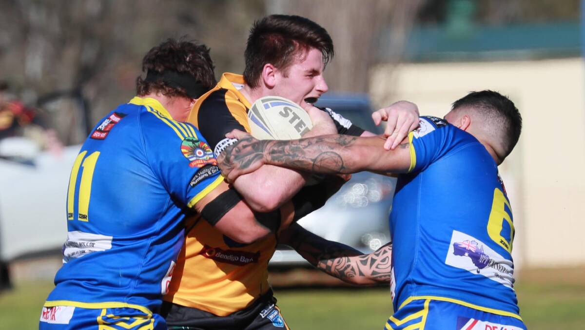 Royce Tout gets caught by the Junee defence earlier this season.