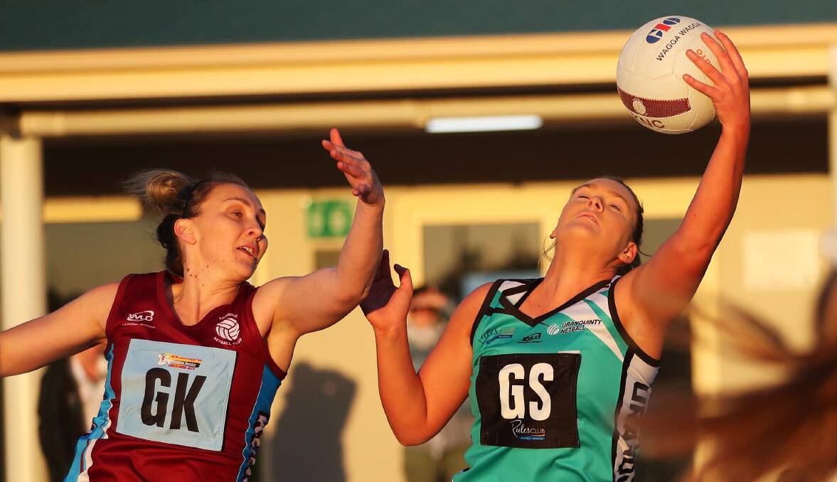 GOOD REACH: Hannah Finemore looks to reel in a lob for Uranquinty to help her team go through to the Wagga Netball grand final. Picture: Emma Hillier