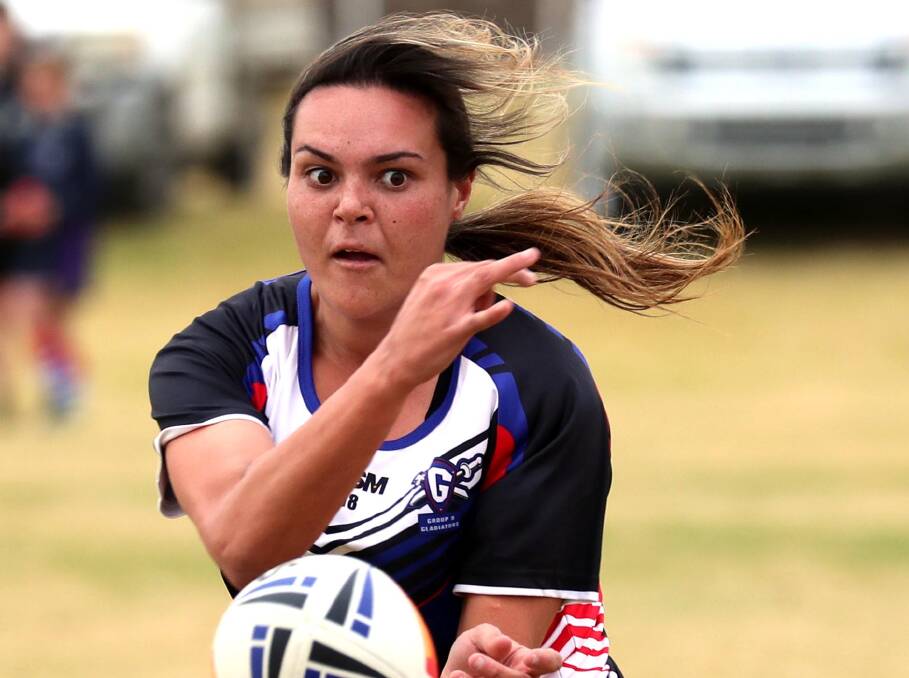 FAST HANDS: Montana Kearnes fires out a pass during Group Nine's 20-12 win over Group 20 in the representative leaguetag clash at Laurie Daley Oval on Saturday. Picture: Les Smith