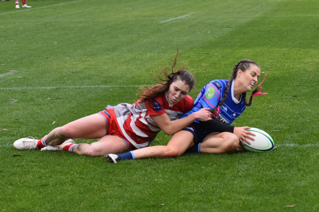 TRY TIME: Ellen McIntyre can't stop Andrea Noldin from scoring her second try as Waratahs took a tight win over previously unbeaten CSU at Conolly Rugby Complex on Saturday. Picture: Courtney Rees