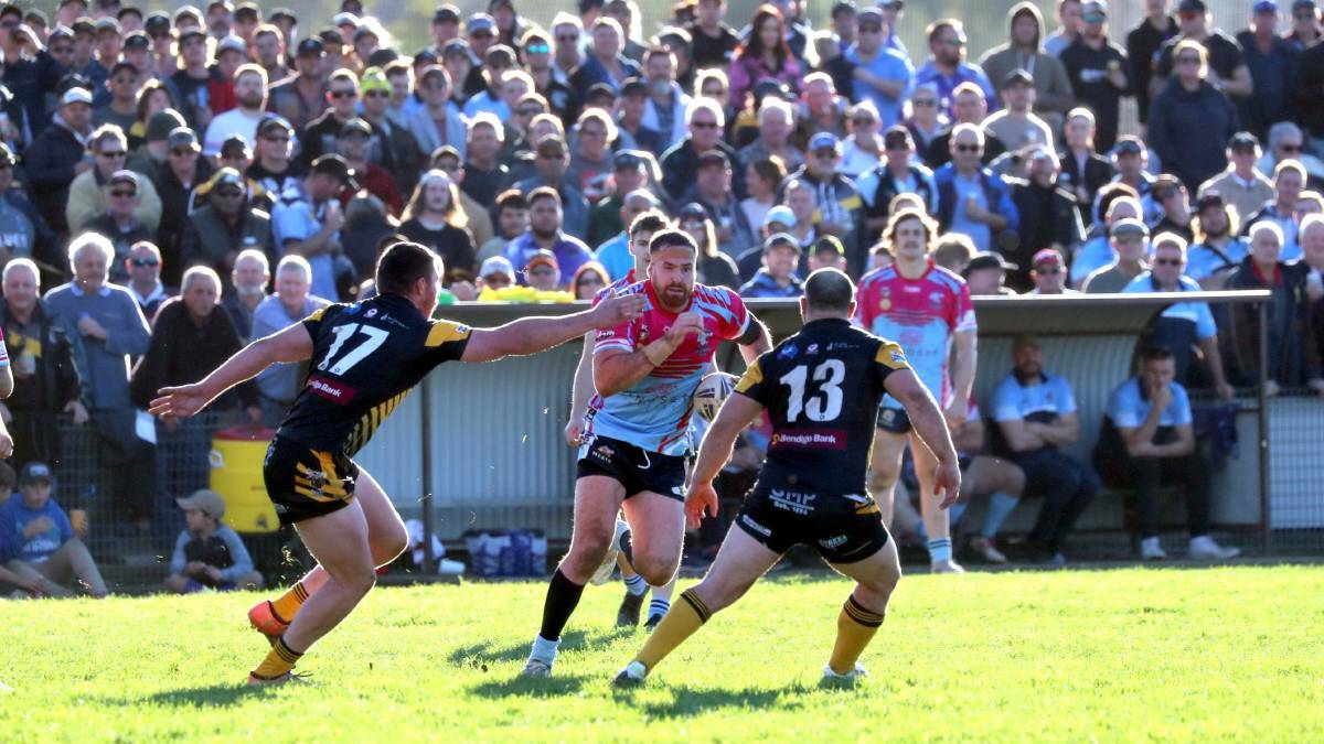 CROWD CONCERN: Tommy Warner brings the ball forward in front of a bumper crowd at Twickenham for the clash between Tumut and Gundagai last season.
