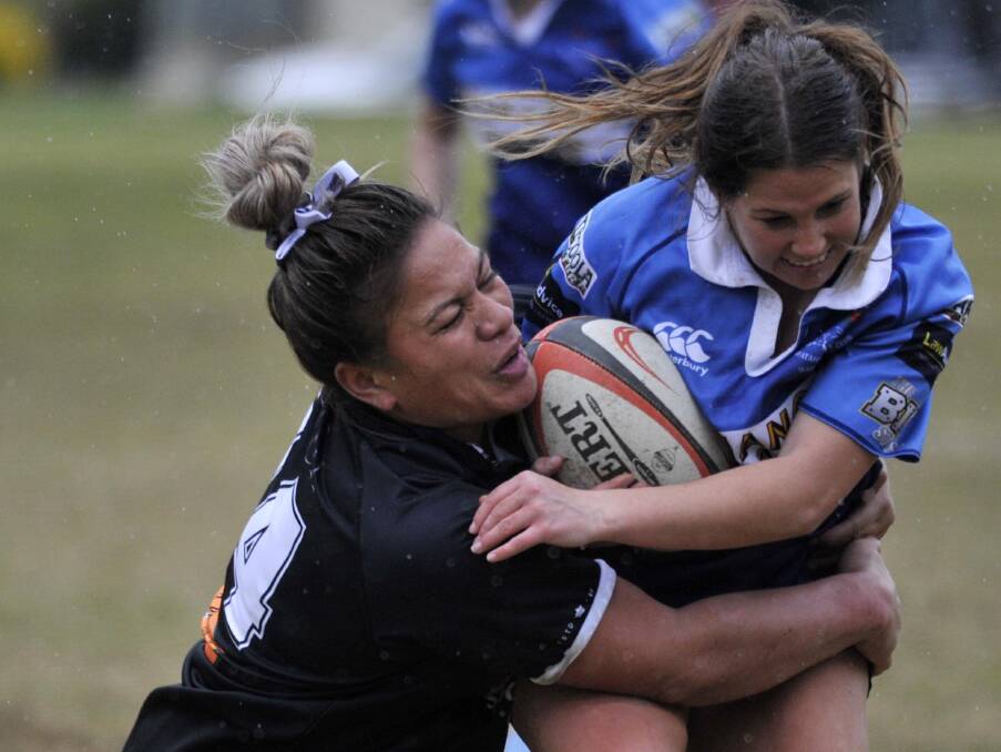 HOLDING ON TIGHT: Griffith co-captain Lauretta Leao-Seve comes in to tackle Holly Stephens in the Blacks preliminary final win over Waratahs on Saturday. They now face CSU in the grand final. Picture: Chelsea Sutton.