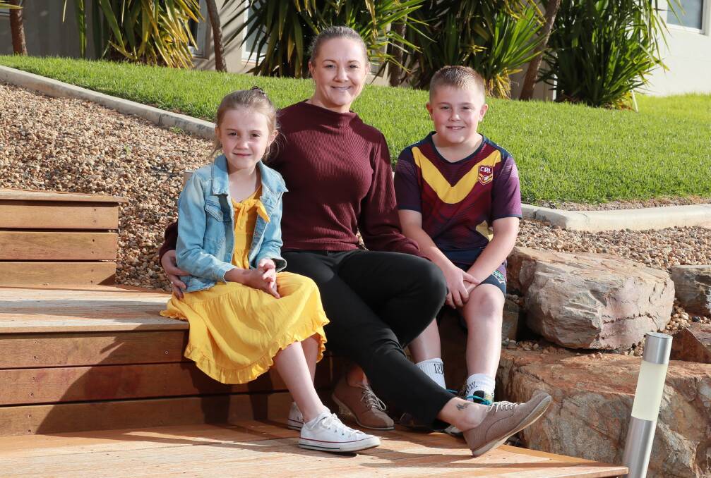 NEXT GOAL: Shannon Pike, with her children Torah, 7, and Mason, 9, is out to help Kangaroos to their second leaguetag title after being part of their first in 2008. Picture: Les Smith